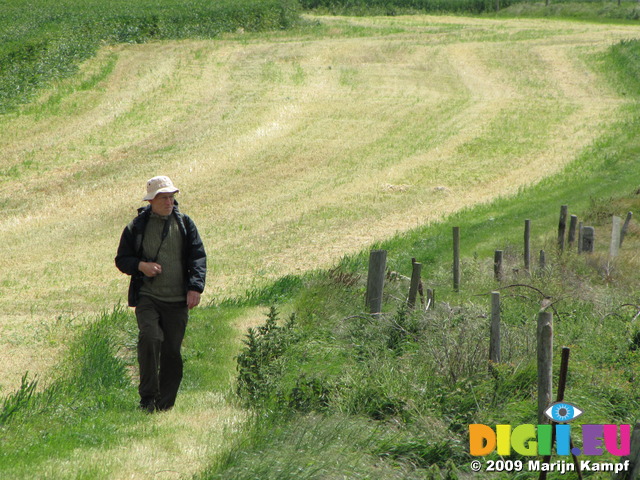 SX06703 Hans walking over cliff path